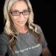 Head shot of Dawn Campbell, white female, blond hair, black rim glasses, wearing a grey t-shirt.