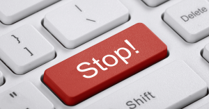 Keyboard with a red button that says stop
